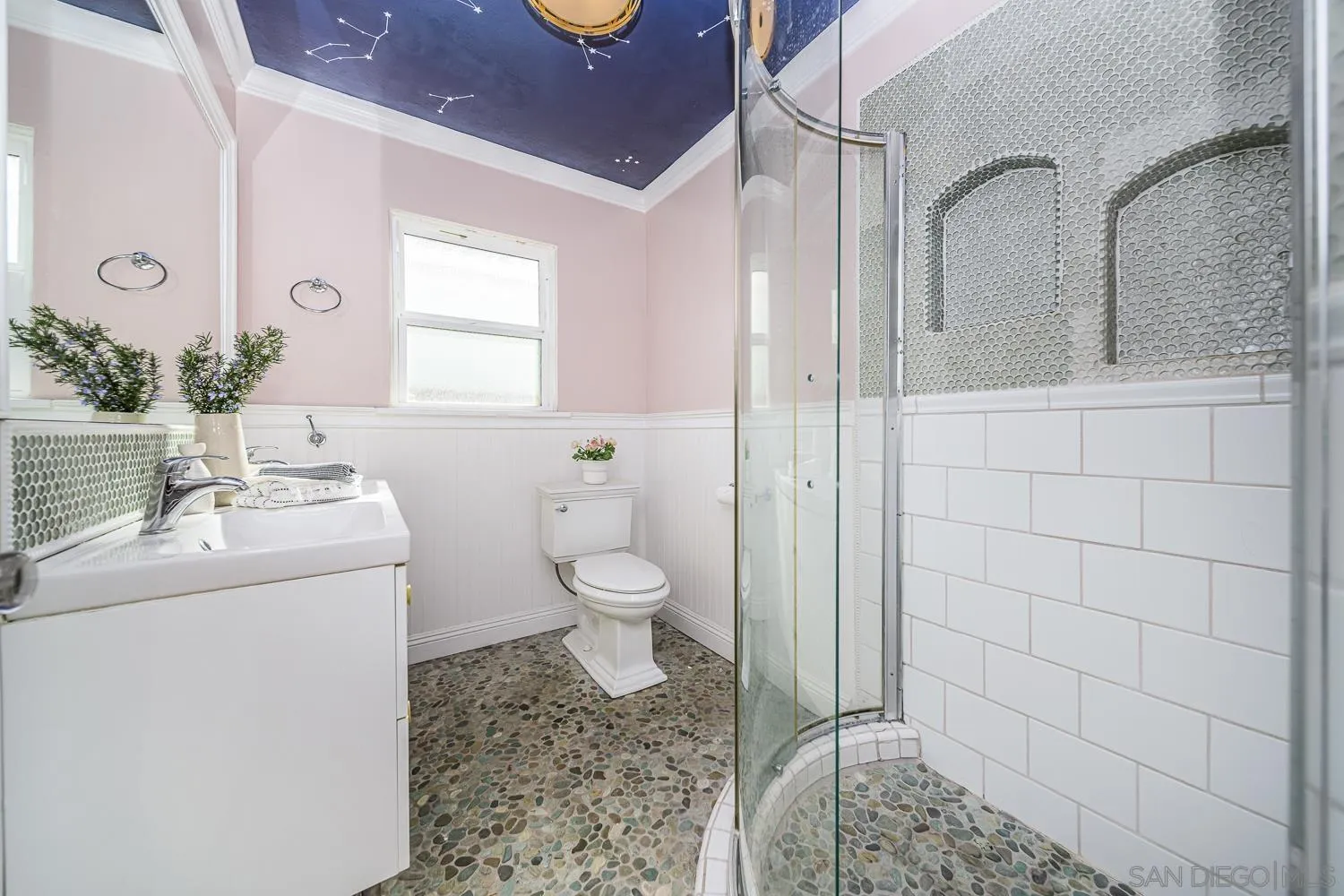 4965 Brighton Avenue Ocean Beach, CA 92107 - Photo 16 of 48 a bathroom with a sink toilet and shower