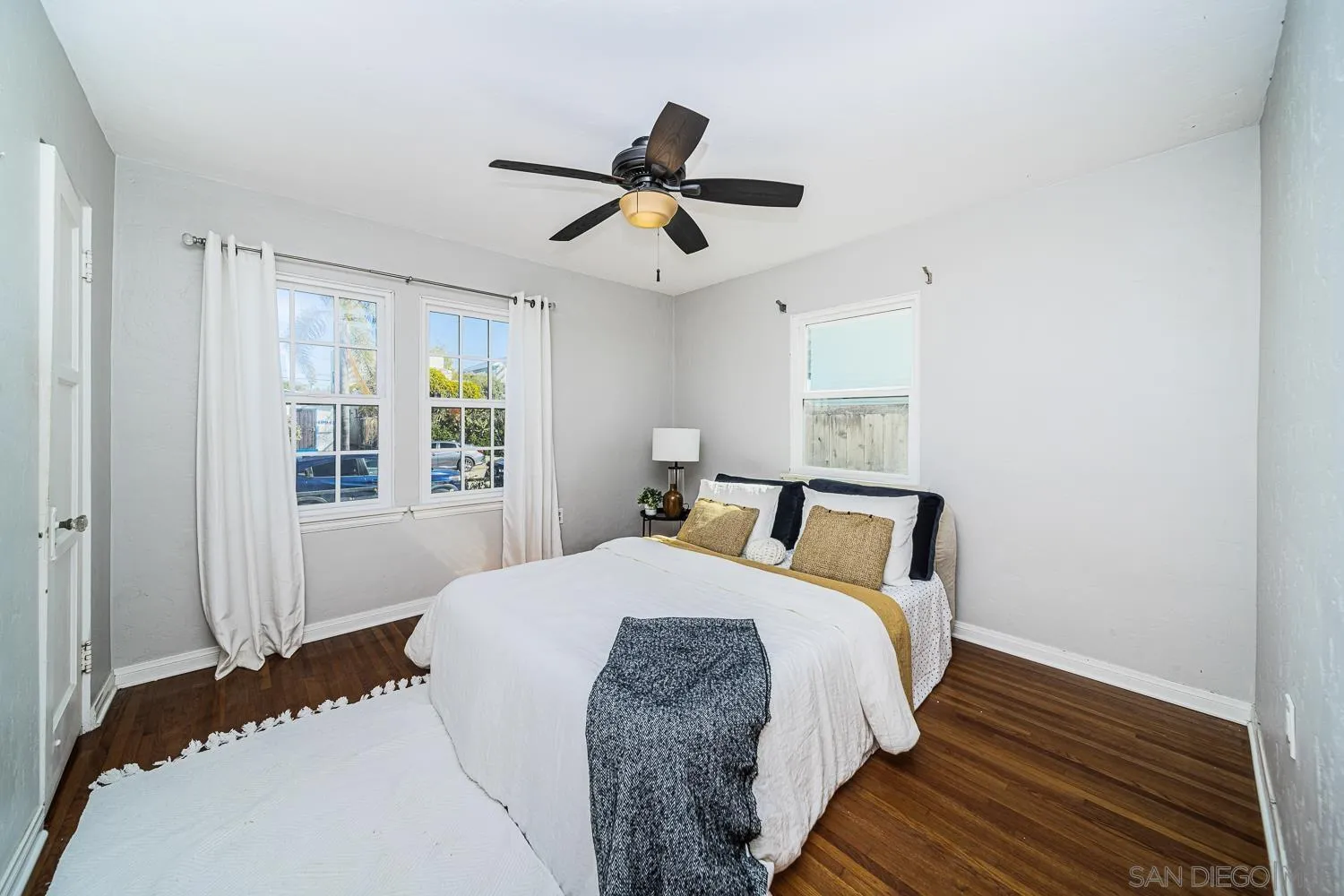 4965 Brighton Avenue Ocean Beach, CA 92107 - Photo 17 of 48 a bedroom with a bed and a window