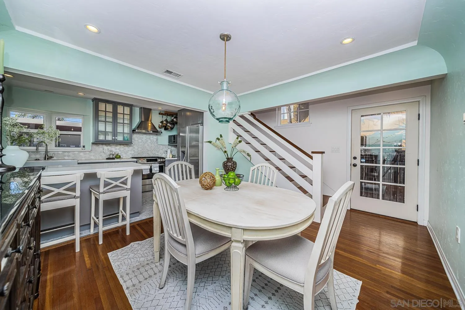 4965 Brighton Avenue Ocean Beach, CA 92107 - Photo 19 of 48 a view of a dining room with furniture window and wooden floor