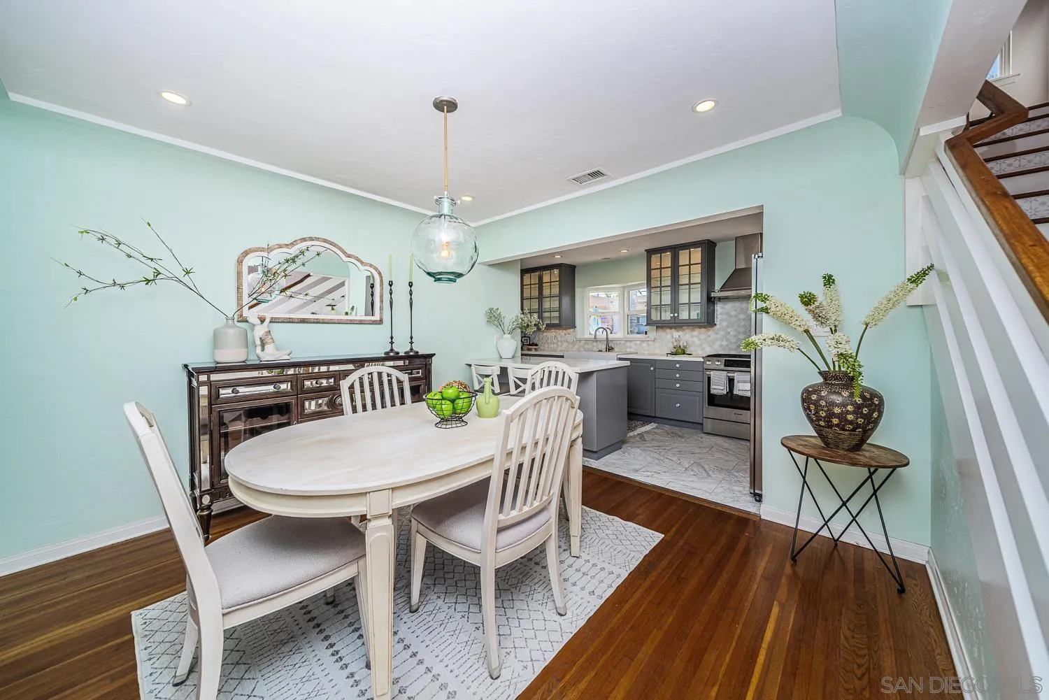 4965 Brighton Avenue Ocean Beach, CA 92107 - Photo 21 of 48 a view of a dining room with furniture window and wooden floor