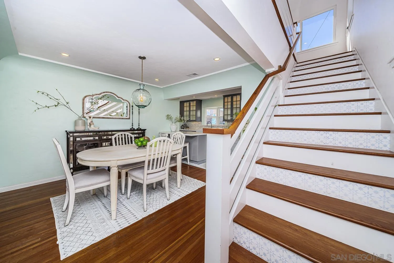 4965 Brighton Avenue Ocean Beach, CA 92107 - Photo 22 of 48 a view of a dining room with furniture wooden floor and chandelier