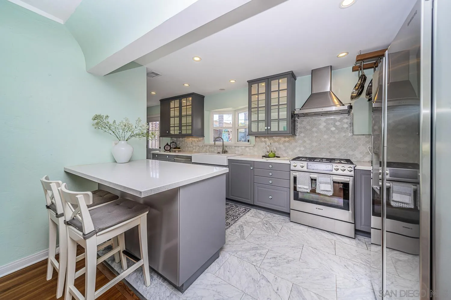 4965 Brighton Avenue Ocean Beach, CA 92107 - Photo 23 of 48 a kitchen with a sink appliances and cabinets