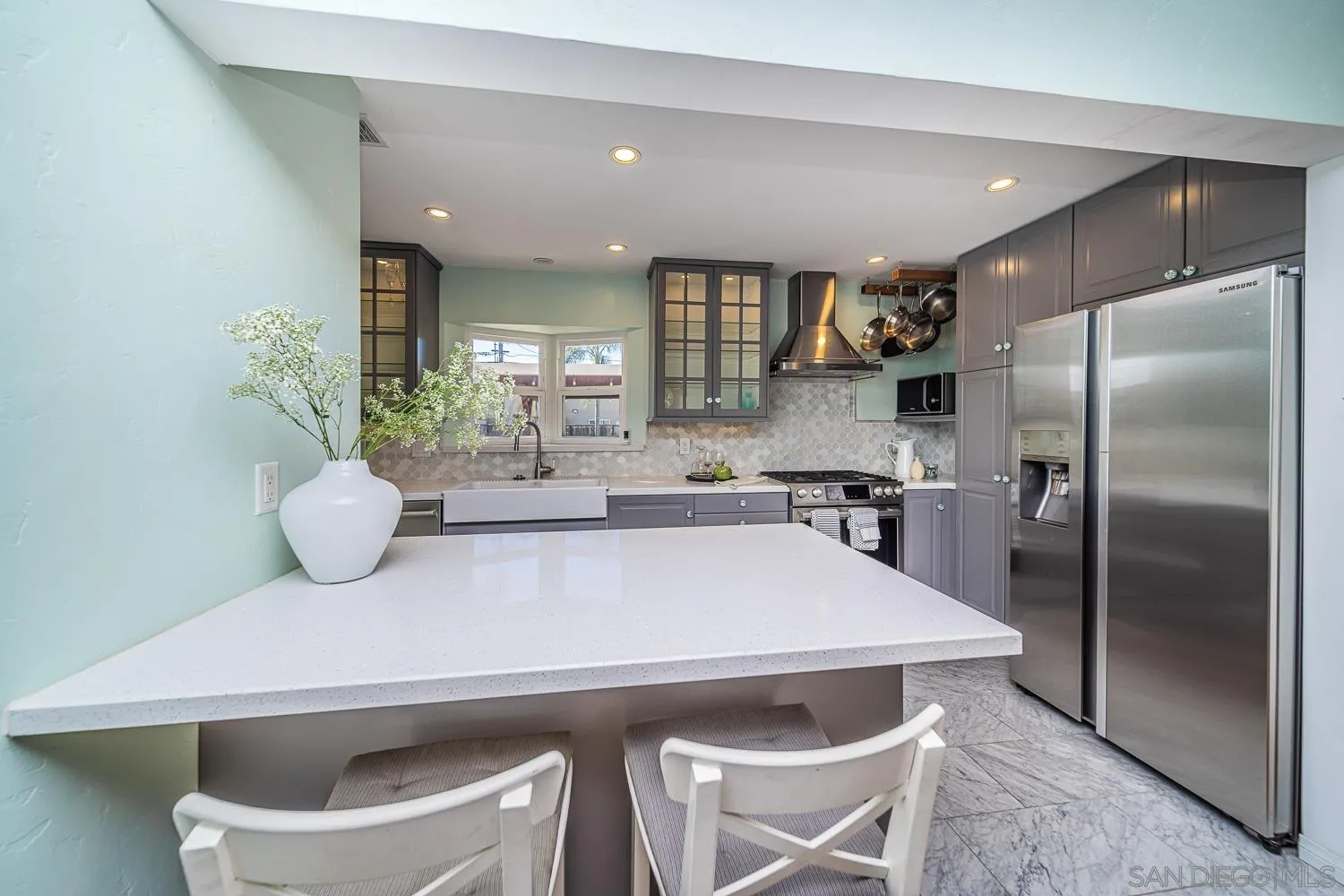 4965 Brighton Avenue Ocean Beach, CA 92107 - Photo 24 of 48 a kitchen with a table and chairs