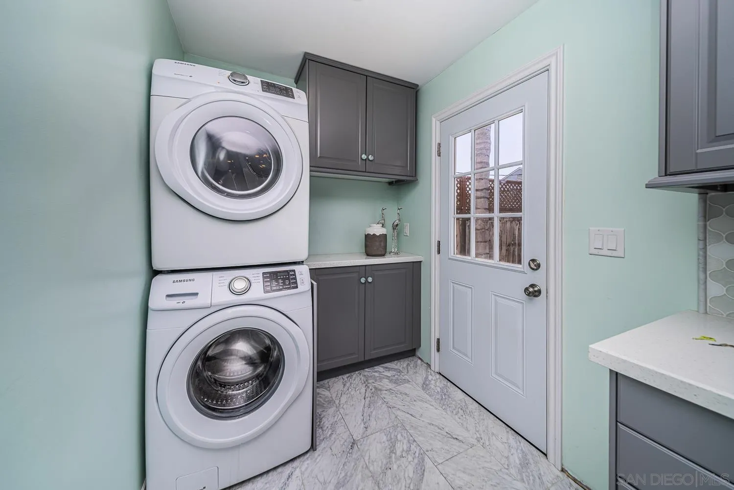 4965 Brighton Avenue Ocean Beach, CA 92107 - Photo 28 of 48 a view of a hallway with washer and dryer