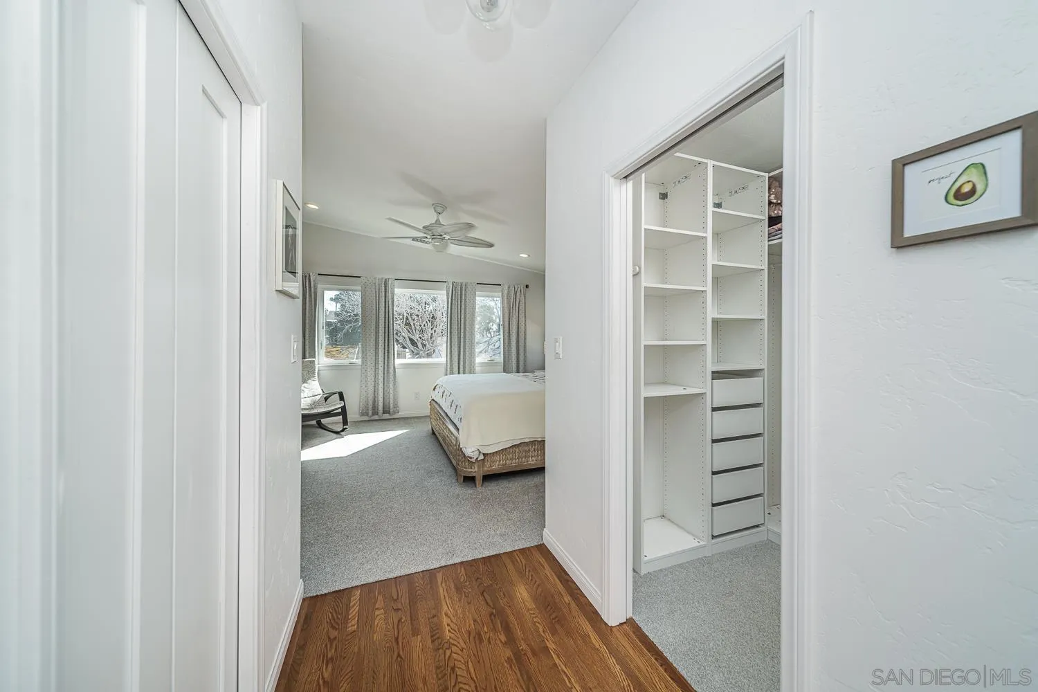 4965 Brighton Avenue Ocean Beach, CA 92107 - Photo 29 of 48 a view of a bedroom with furniture and wooden floor