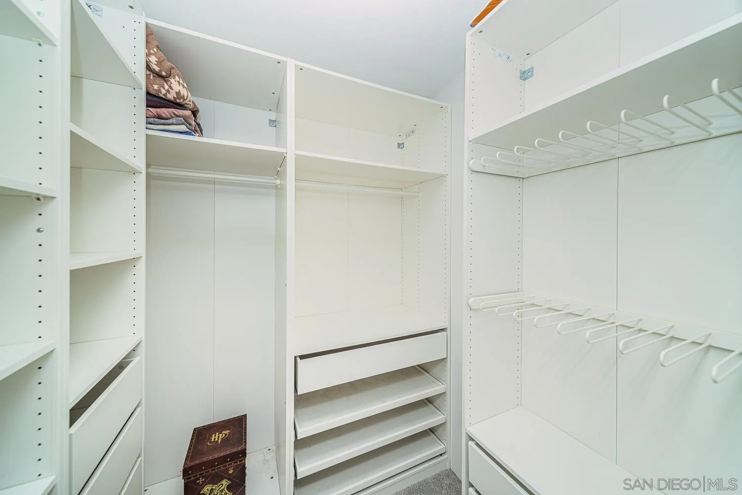 4965 Brighton Avenue Ocean Beach, CA 92107 - Photo 30 of 48 a view of walk in closet with empty racks