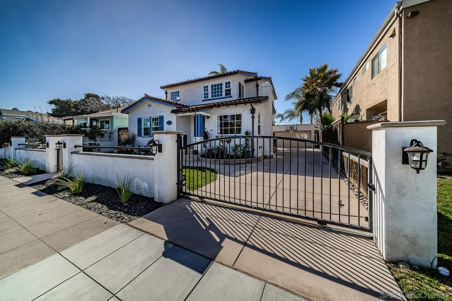 4965 Brighton Avenue Ocean Beach, CA 92107 - Photo 48 of 48 a view of a brick house with many windows
