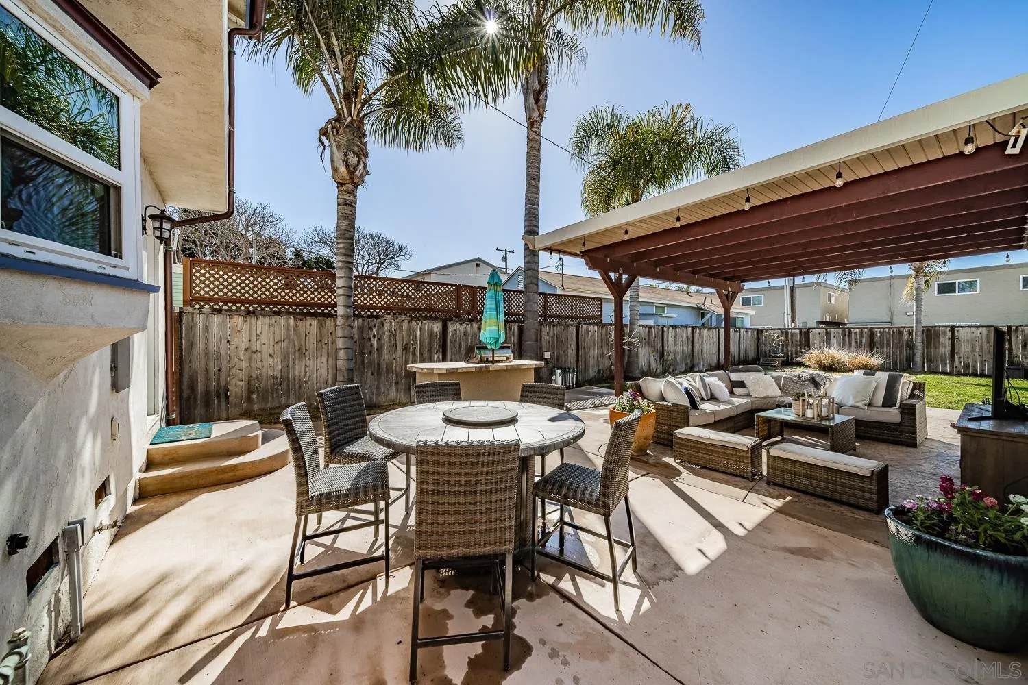 4965 Brighton Avenue Ocean Beach, CA 92107 - Photo 5 of 48 a view of a patio with couches and a fire pit