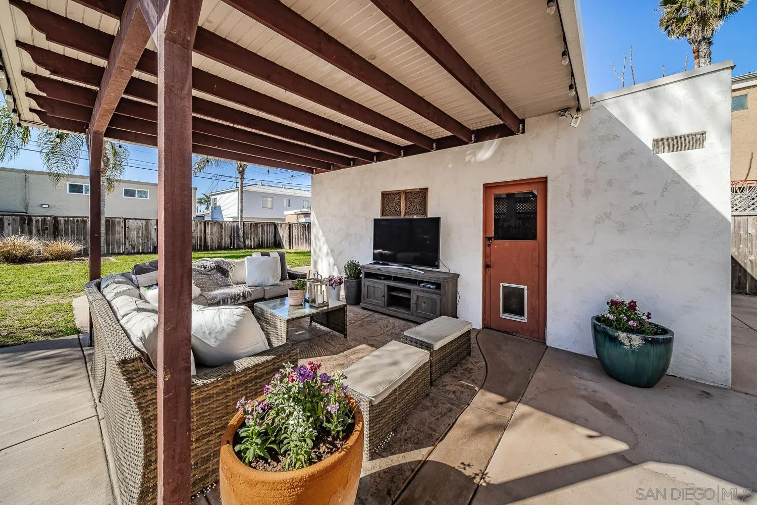 4965 Brighton Avenue Ocean Beach, CA 92107 - Photo 7 of 48 a view of a porch with furniture and a potted plants