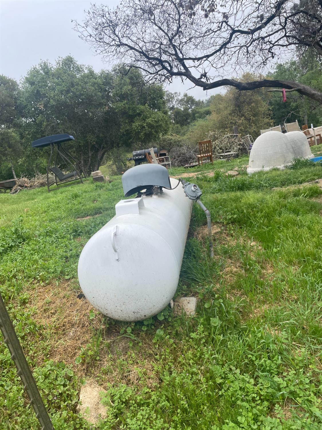 46304 Skyline Ridge Road Coarsegold, CA 93614 - Photo 3 of 12 a backyard of a house with table and chairs