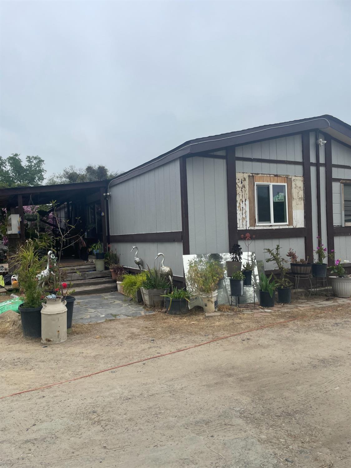 46304 Skyline Ridge Road Coarsegold, CA 93614 - Photo 4 of 12 a front view of house with yard