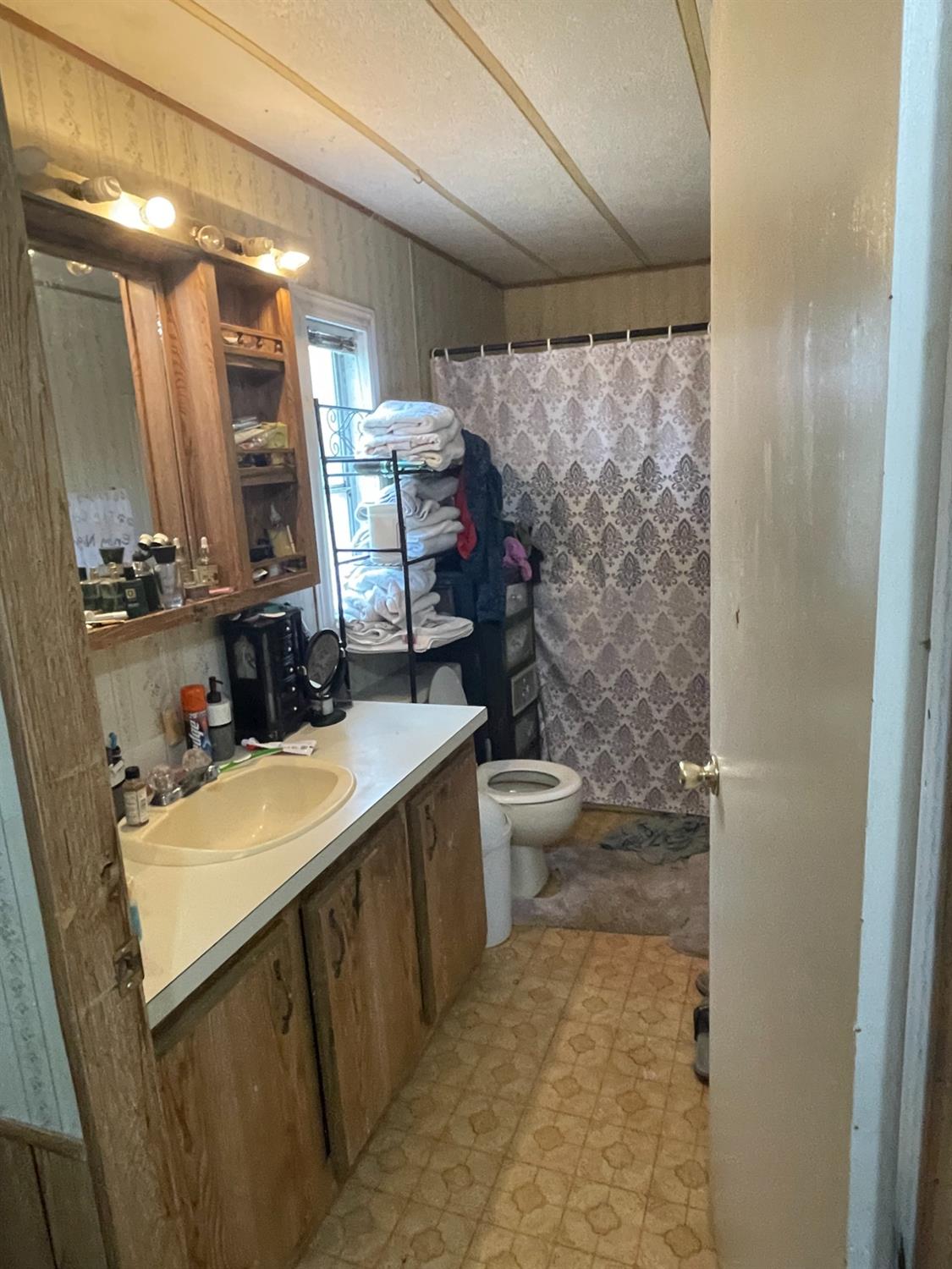 46304 Skyline Ridge Road Coarsegold, CA 93614 - Photo 6 of 12 a bathroom with a sink and a mirror