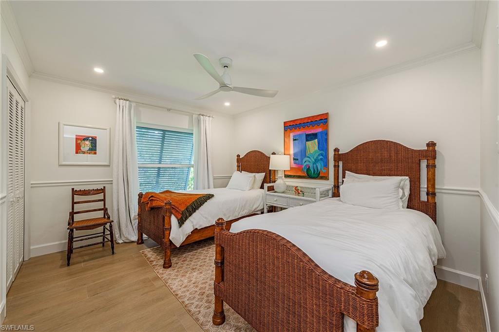 301 Ridge Drive Naples, FL 34108 - Photo 10 of 12 a bedroom with two beds and a window