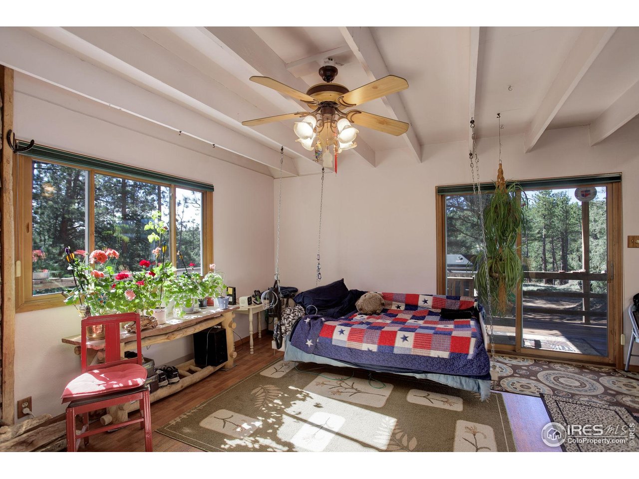 147 Cedar Drive Lyons, CO 80540 - Photo 11 of 37 Living Room has access to the front deck.