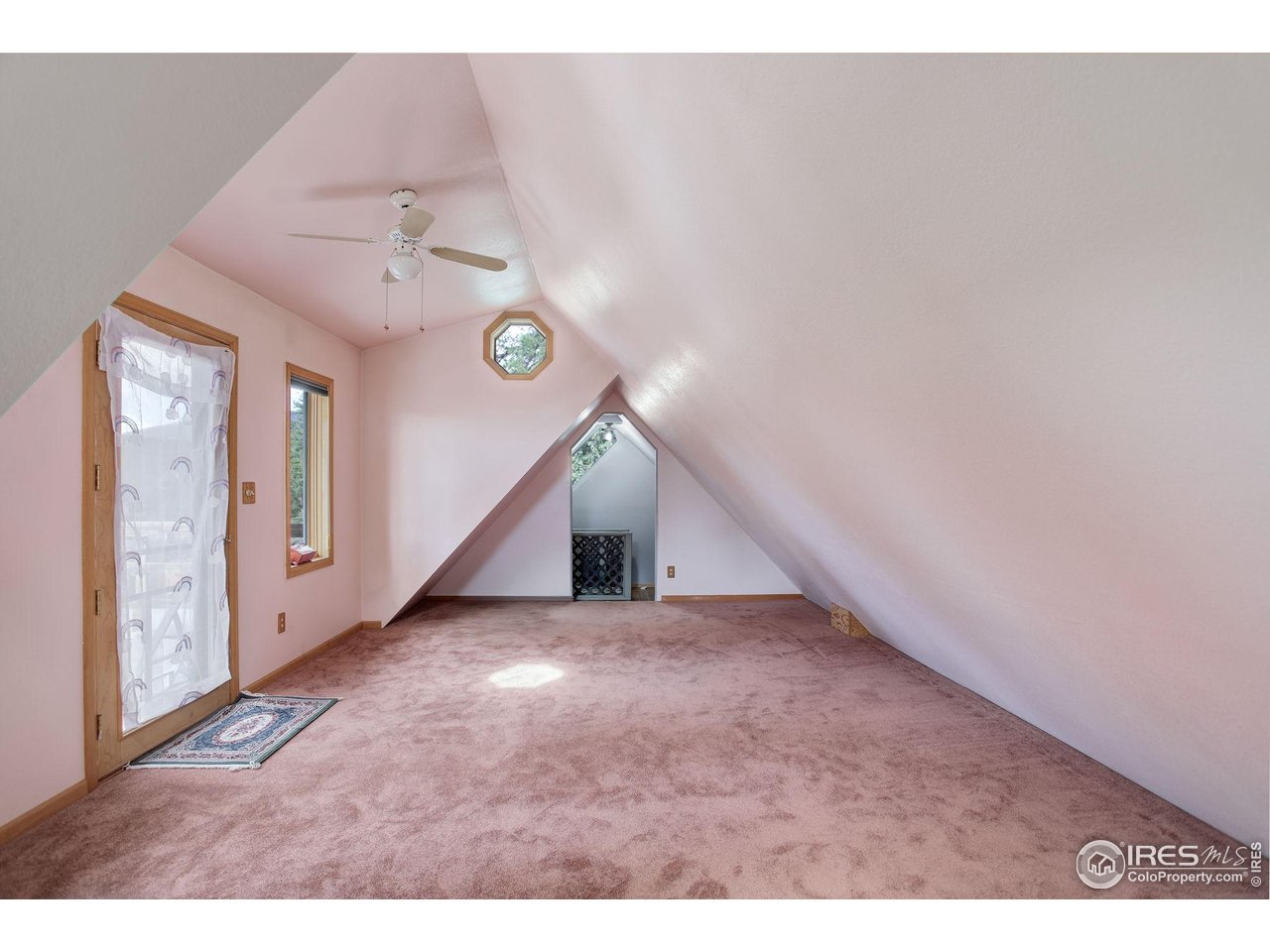 147 Cedar Drive Lyons, CO 80540 - Photo 17 of 37 Loft space that the Seller used as his bedroom for years. Balcony deck with amazing views of Mt. Audobon.