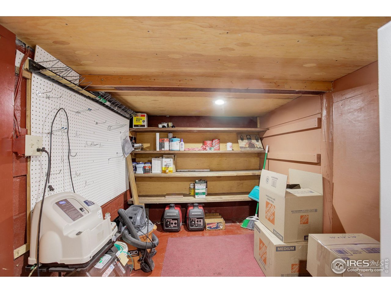 147 Cedar Drive Lyons, CO 80540 - Photo 23 of 37 Shop space in basement.