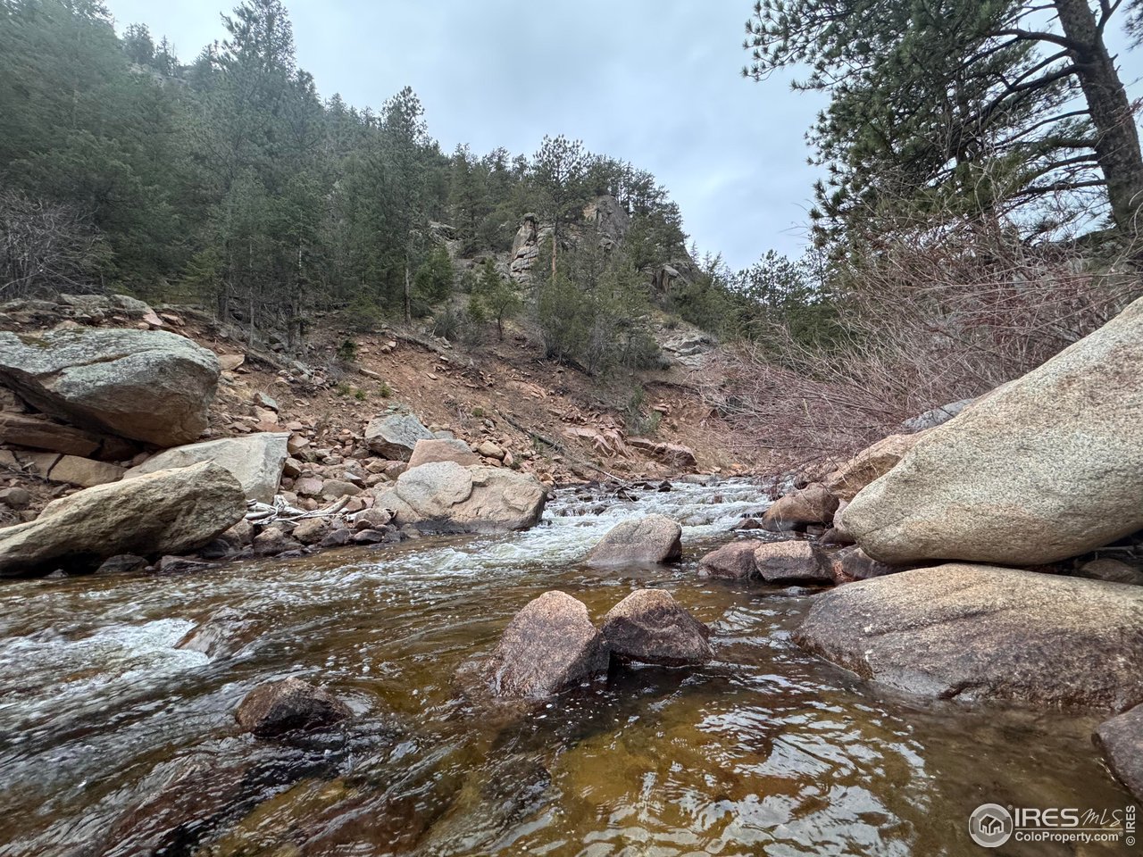 147 Cedar Drive Lyons, CO 80540 - Photo 33 of 37 St. Vrain Creek just down the road to dip your feet or cast a fly.