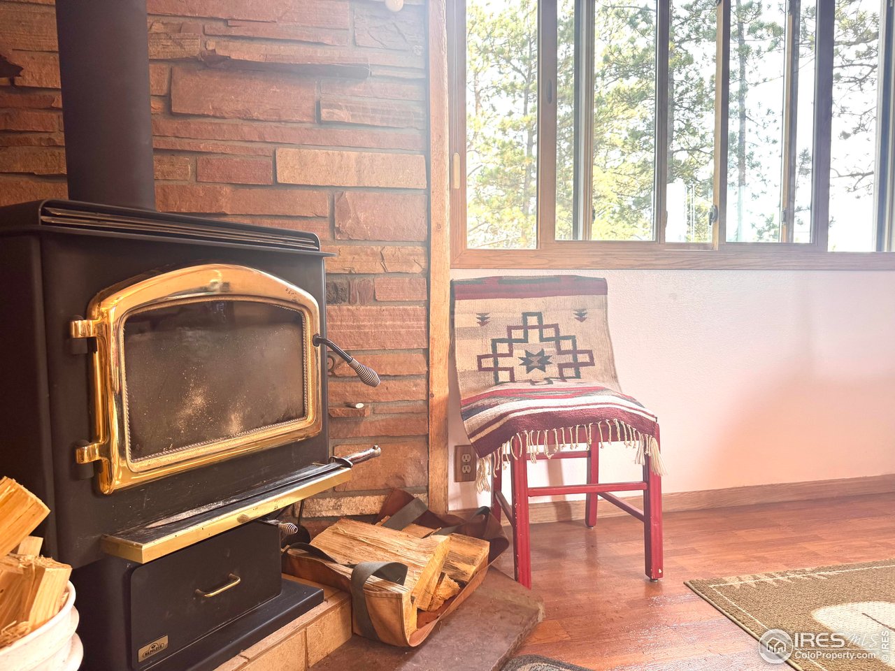 147 Cedar Drive Lyons, CO 80540 - Photo 7 of 37 There is a primary heat source of a propane powered thermal heater, but the wood stove keeps you extra comfy and the ambiance pairs will with the scennry.