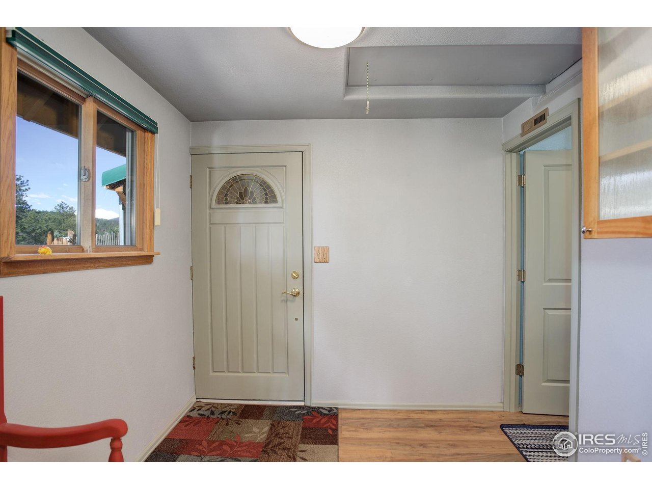 147 Cedar Drive Lyons, CO 80540 - Photo 9 of 37 Mudroom and access to loft space off the kitchen.