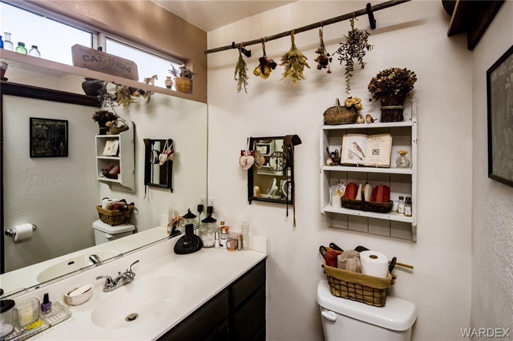 2333 Primavera Loop Fort Mohave, AZ 86426 - Photo 25 of 57 a bathroom with a sink and a mirror