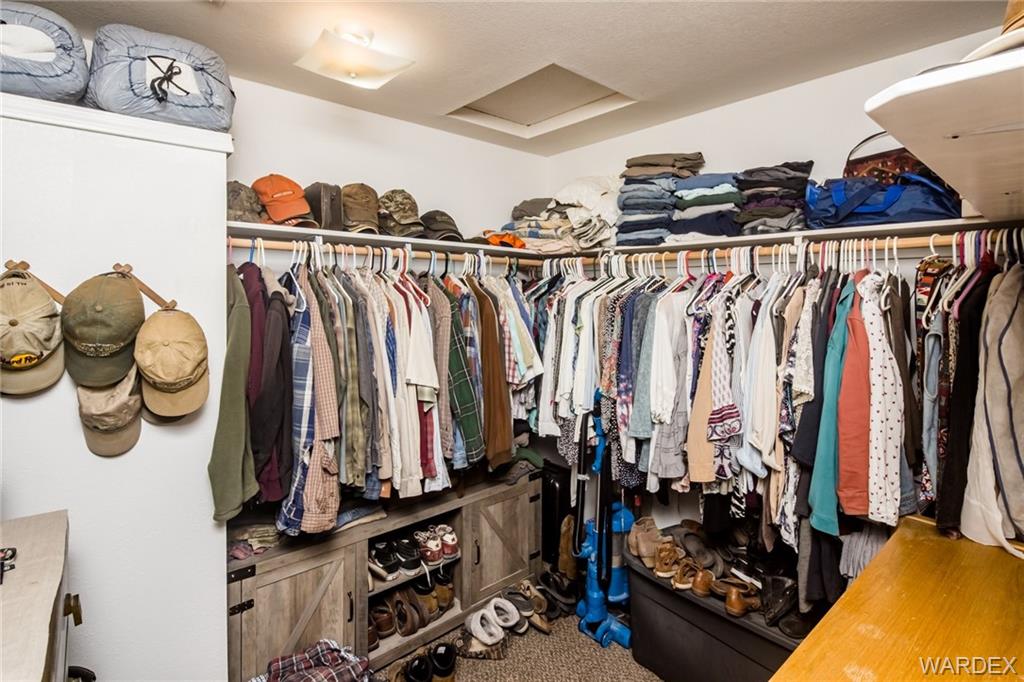 2333 Primavera Loop Fort Mohave, AZ 86426 - Photo 27 of 57 a view of walk in closet with clothes and shoes