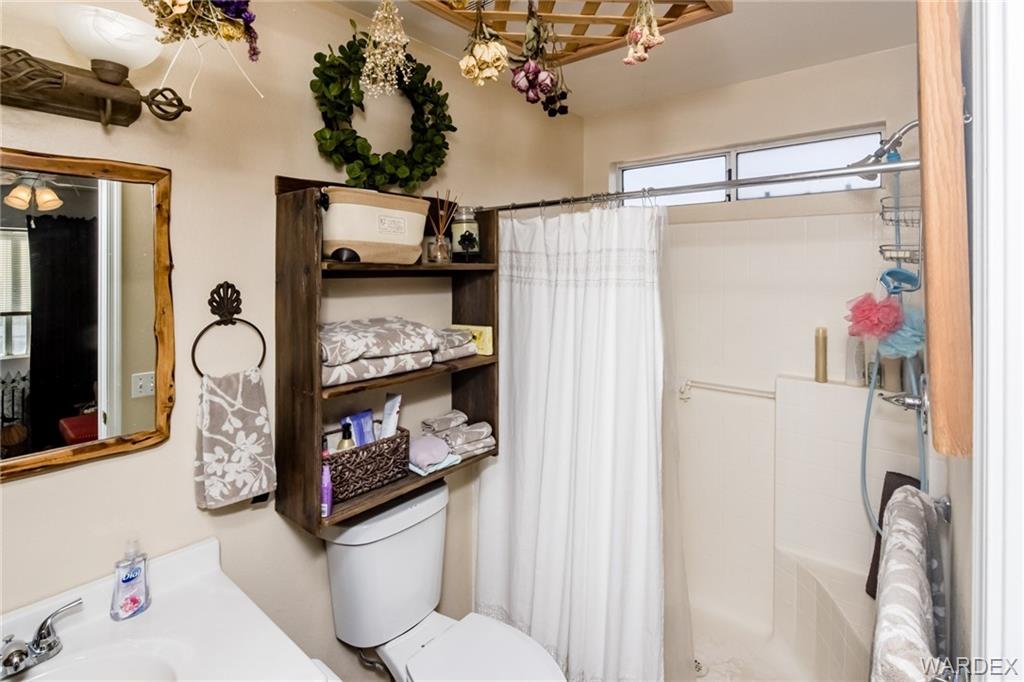 2333 Primavera Loop Fort Mohave, AZ 86426 - Photo 30 of 57 a bathroom with a sink toilet and shower