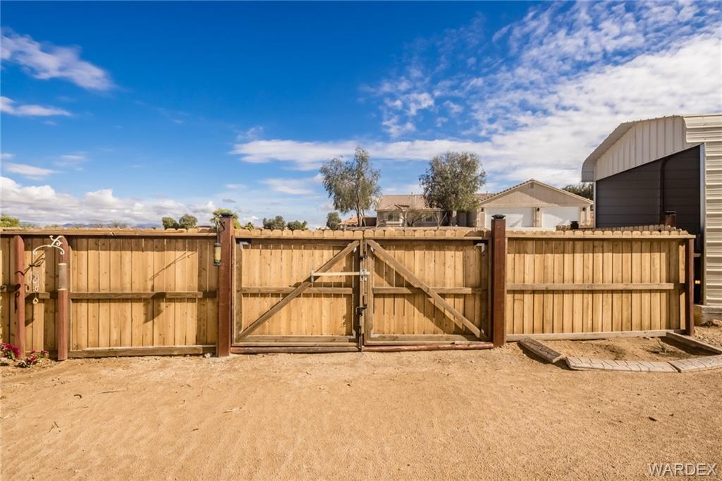 2333 Primavera Loop Fort Mohave, AZ 86426 - Photo 40 of 57 a view of a terrace with wooden floor and fence