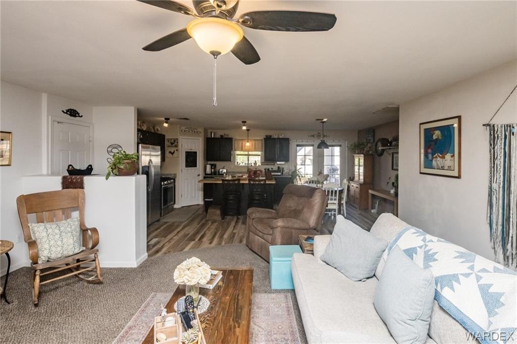 2333 Primavera Loop Fort Mohave, AZ 86426 - Photo 10 of 57 a living room with furniture and kitchen view