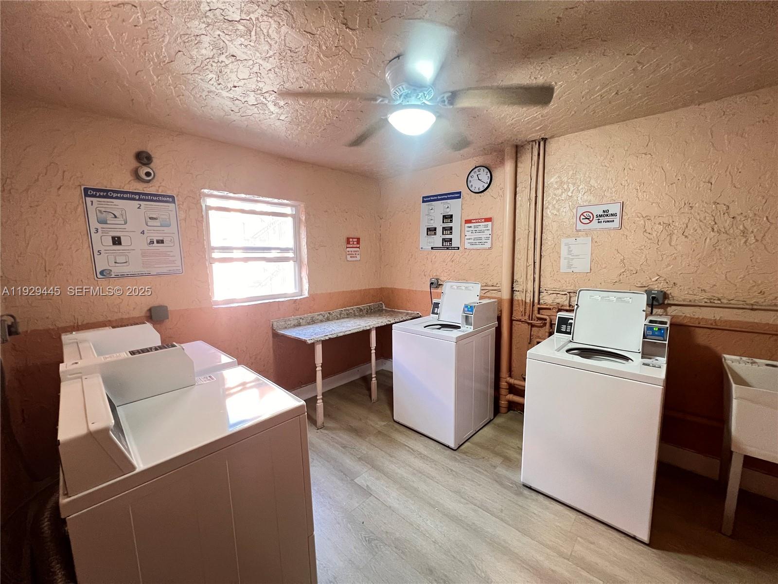 1855 West 60th Street, Unit 430 Hialeah, FL 33012 - Photo 16 of 16 a workspace with furniture and window