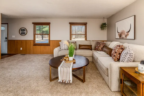 a kitchen with stainless steel appliances granite countertop a sink stove cabinets and wooden floor