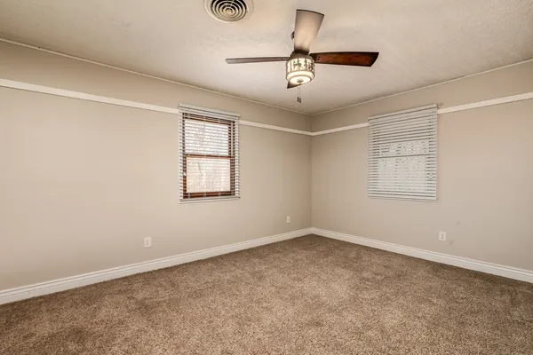 a view of an empty room with a balcony