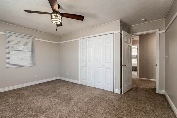 a view of an empty room with wooden walls
