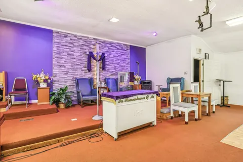 a living room with furniture and flat screen tv