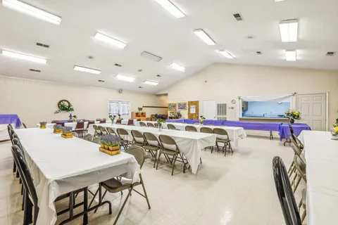 a view of a dining area with furniture and a table