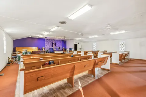 a kitchen with stainless steel appliances lots of counter top space and living room