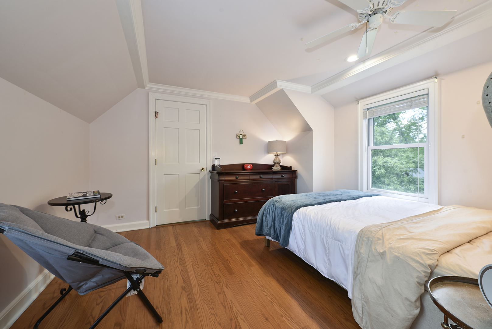 110 North Inverway Road Inverness, IL 60067 - Photo 18 of 27 a bedroom with a bed and a chandelier