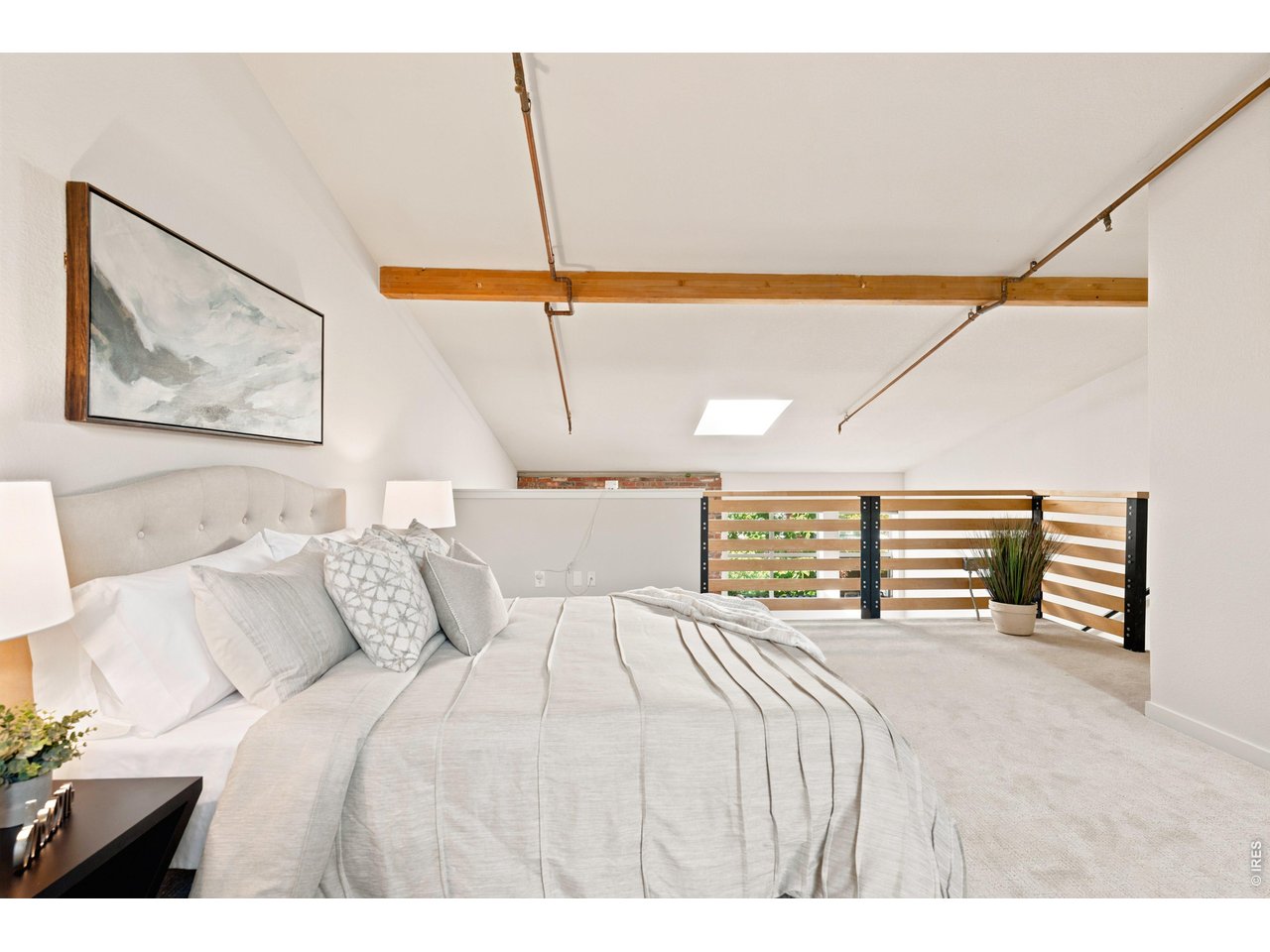 3033 Blake Street, Unit 112 Denver, CO 80205 - Photo 22 of 28 a bed room with a bed and a large window
