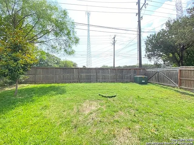 a view of backyard with green space