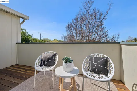 a table and chairs in a balcony