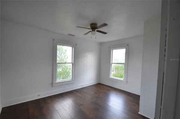 an empty room that has a window in it