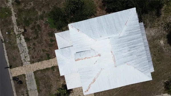 an aerial view of a house with outdoor space