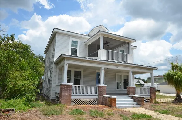front view of a house with a yard