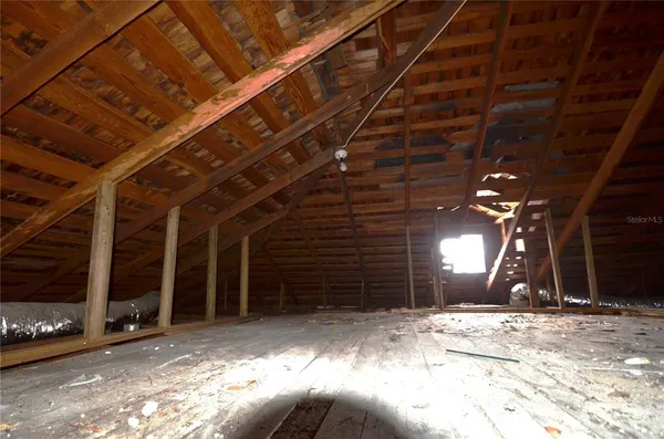 a view of a backyard with sitting area