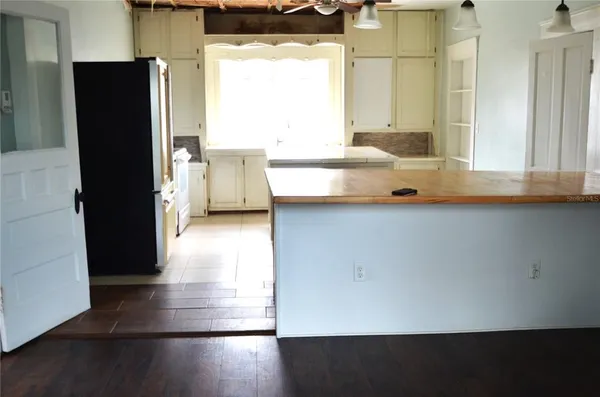 a view of a bathroom with a sink and a mirror