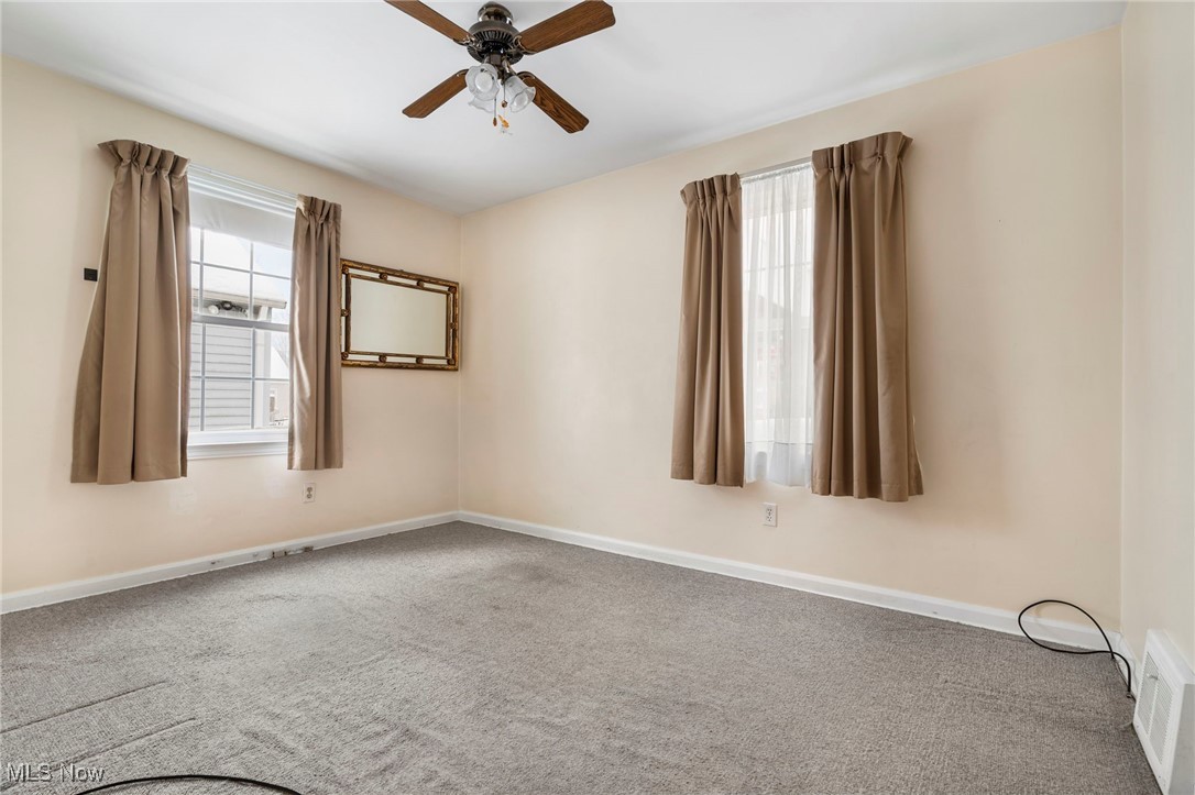 3002 Joseph Street Northwest Canton, OH 44708 - Photo 13 of 18 Empty room featuring carpet floors and ceiling fan