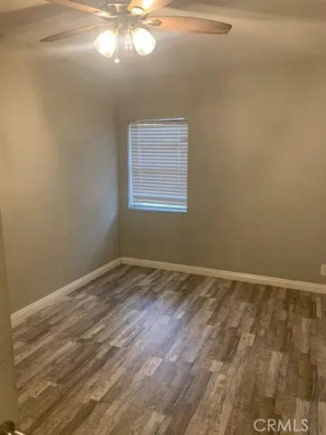 a view of hallway with wooden floor