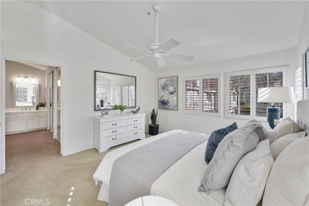 2325 Dunes Tustin, CA 92782 - Photo 15 of 25 a bedroom with a large bed and a chandelier