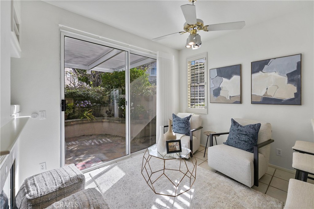 2325 Dunes Tustin, CA 92782 - Photo 8 of 25 a living room with furniture and a floor to ceiling window