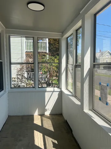a view of a large window with wooden floor