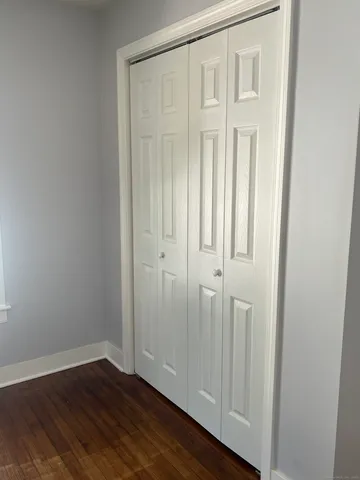 an empty room with wooden floor